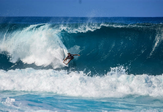 Surfer riding wave at Zicatela beach break